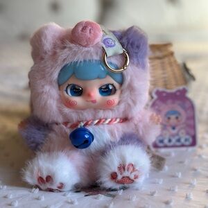 Adorable Plush Stuffed Animal with Blue and Pink Accents